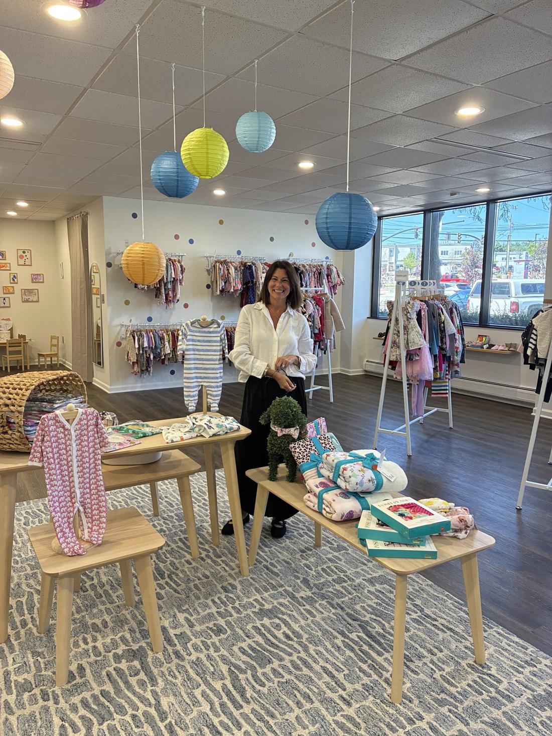 Children's clothing and the owner inside The Young Wardrobe